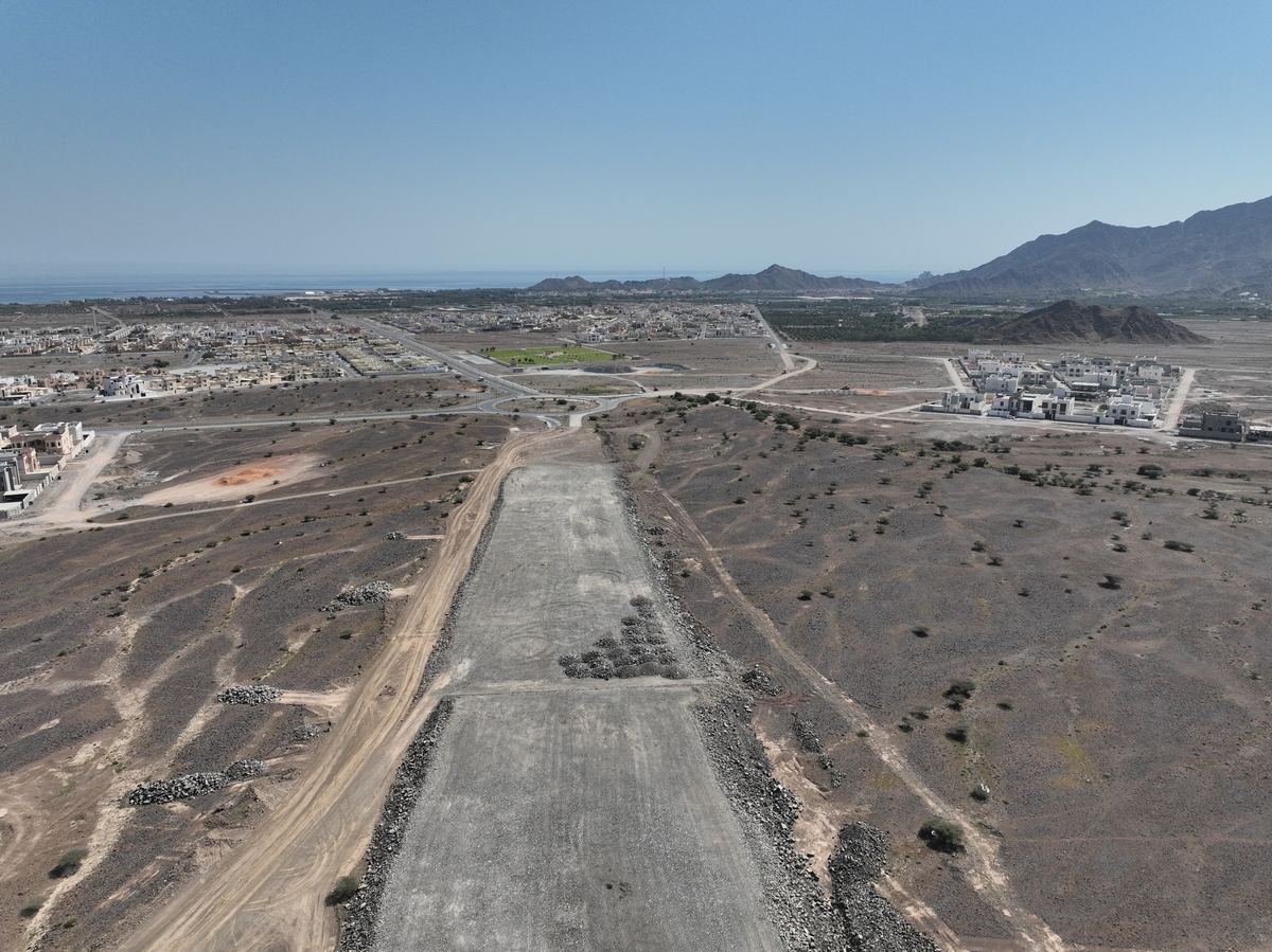Aerial view of the road corridor and surrounding development in Dibba Al Fujairah