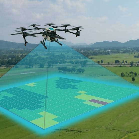 Drone flying over farmland capturing aerial survey data